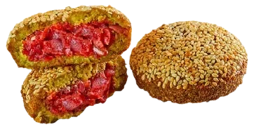 Image of a falafel cut in half revealing a cross-section view